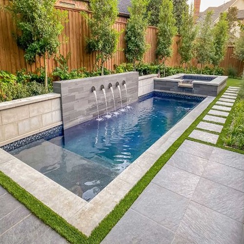 Modern pool with water features.