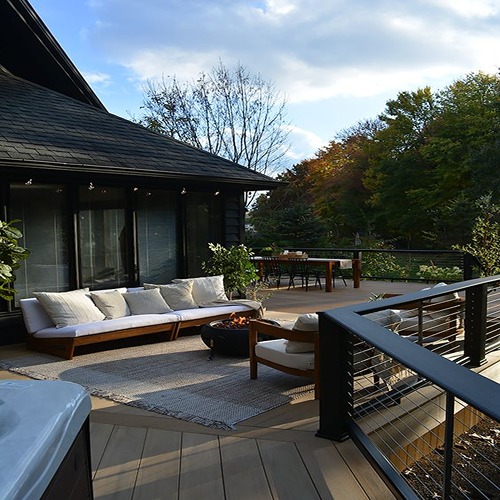 Cozy outdoor seating with greenery.