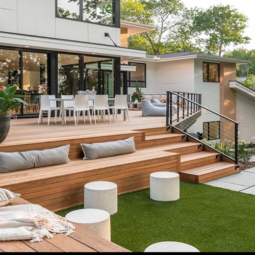 Modern patio with wooden steps and furniture