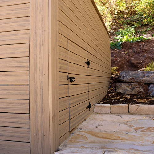 Wooden storage shed with metal latches